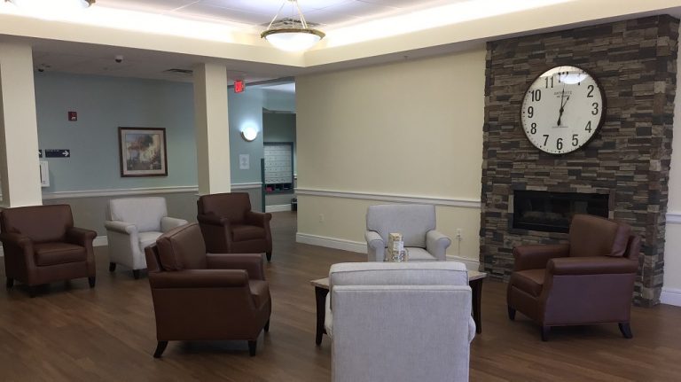 Front Lobby with chairs and a clock.